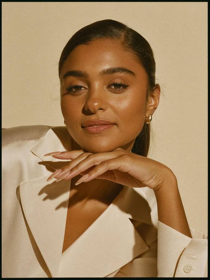 Portrait of a guest with long soft nude almond nails